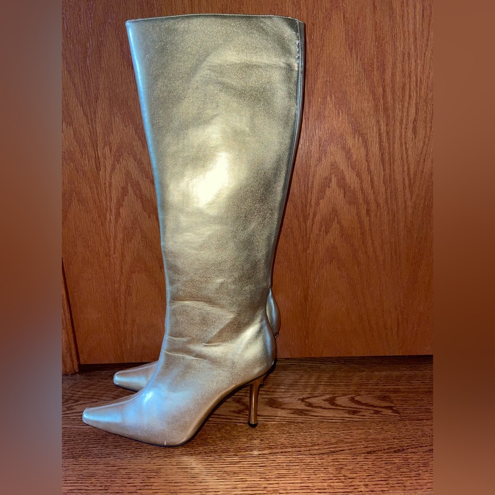 Tall gold stiletto Fredericks of Hollywood boots.